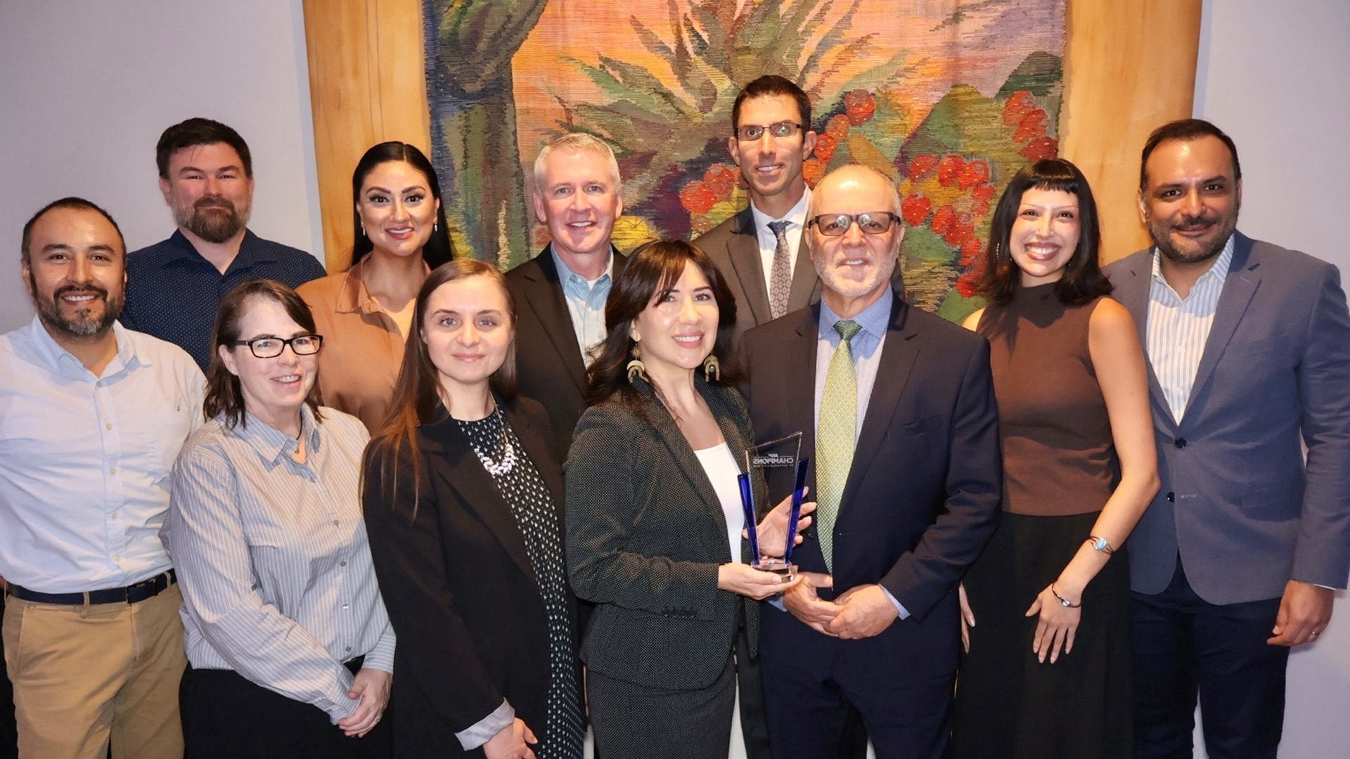 Group of people receiving award office of sustainability and public works