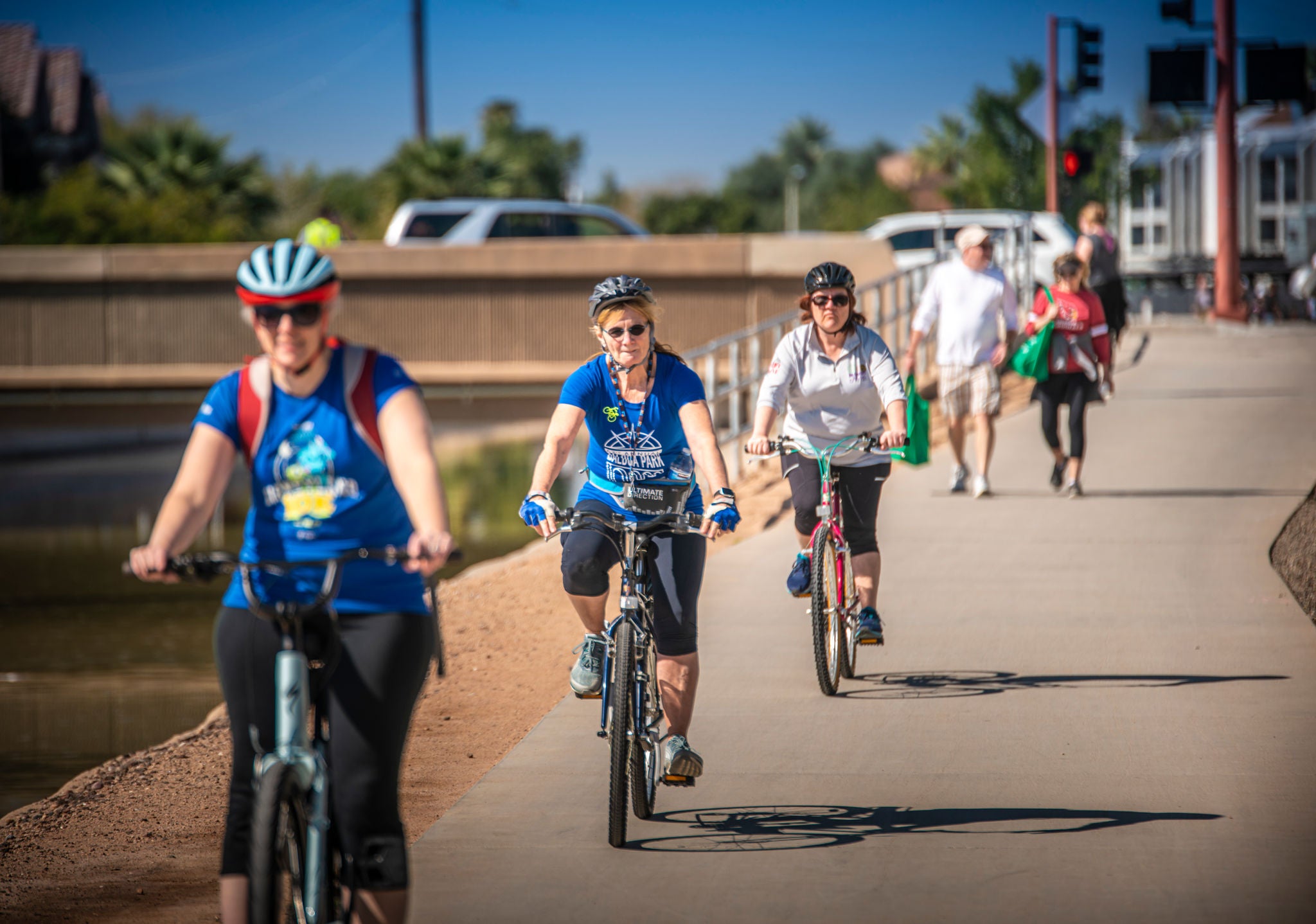 People riding bicycles along the Grand Canalscape