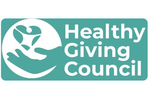 Healthy Giving council in white font with an outstretched hand holding a heart