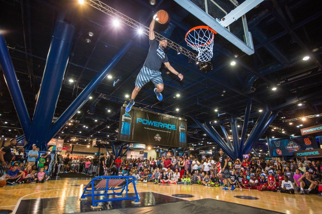 Man flying through the air with a basketball