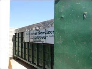 Roll-off dumpster closed while not in use.