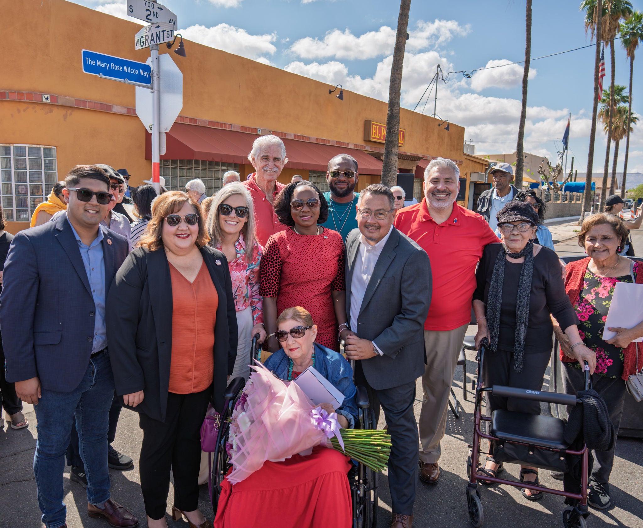 Group photo honoring Mary Rose Wilcox during cermonial sign unveiling.