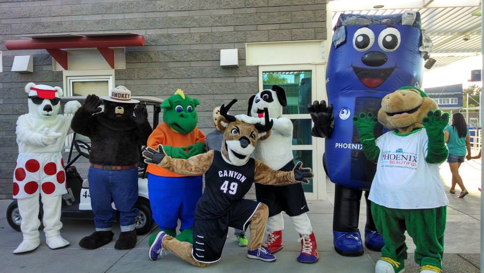 Binny and Recyclesaurus, two Phoenix recycling mascots, pose for a picture with other local mascots, including the GCU antelope and Smoky Bear.