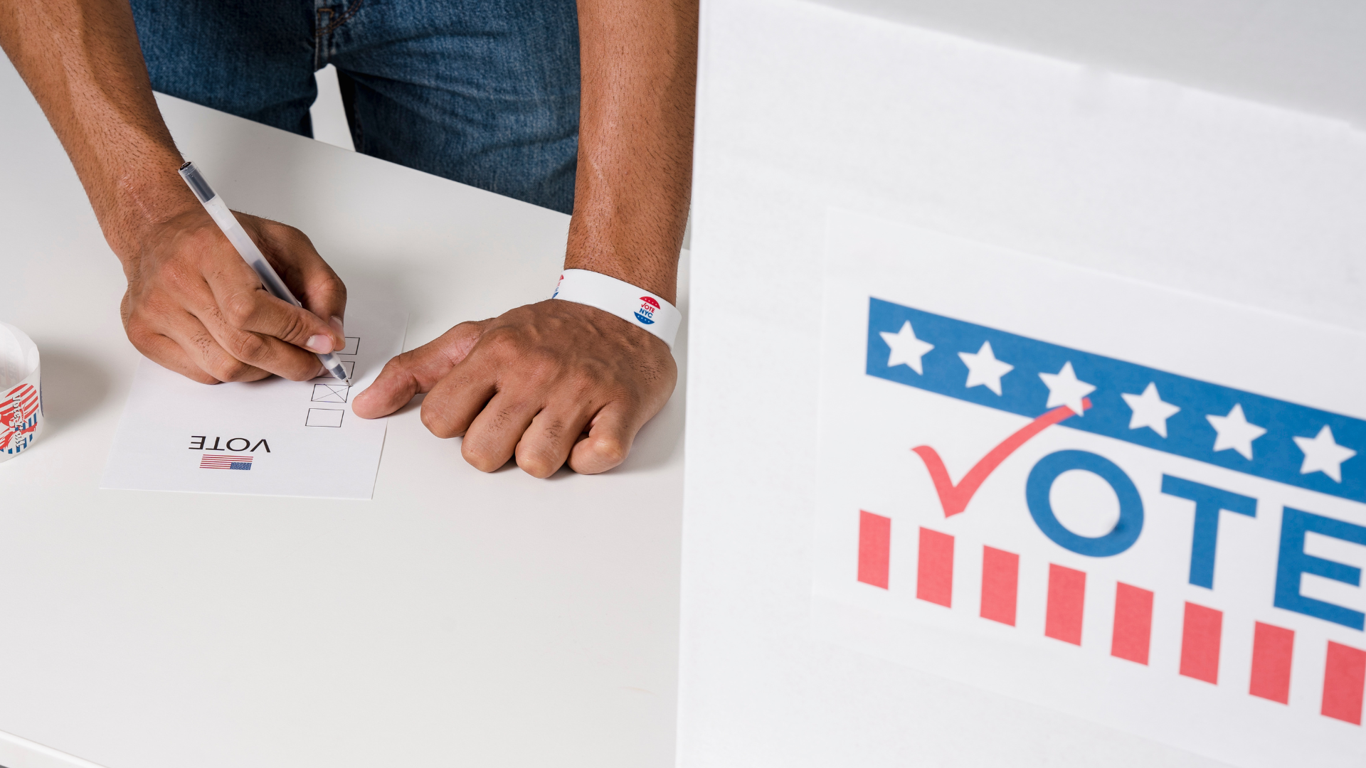 Graphic of someone filling out a square to vote