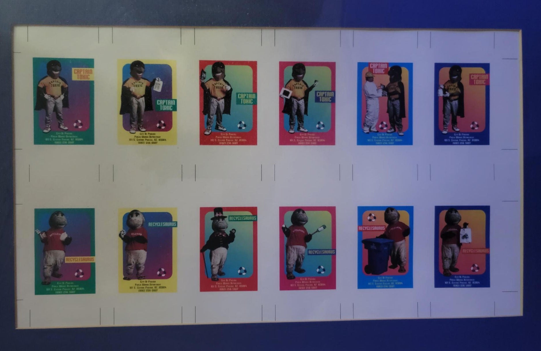 A collectors page of trading cards that feature the mascot Captain Toxic. Each card features his picture (an overly large face with a black mask over the eyes and a blue cape)