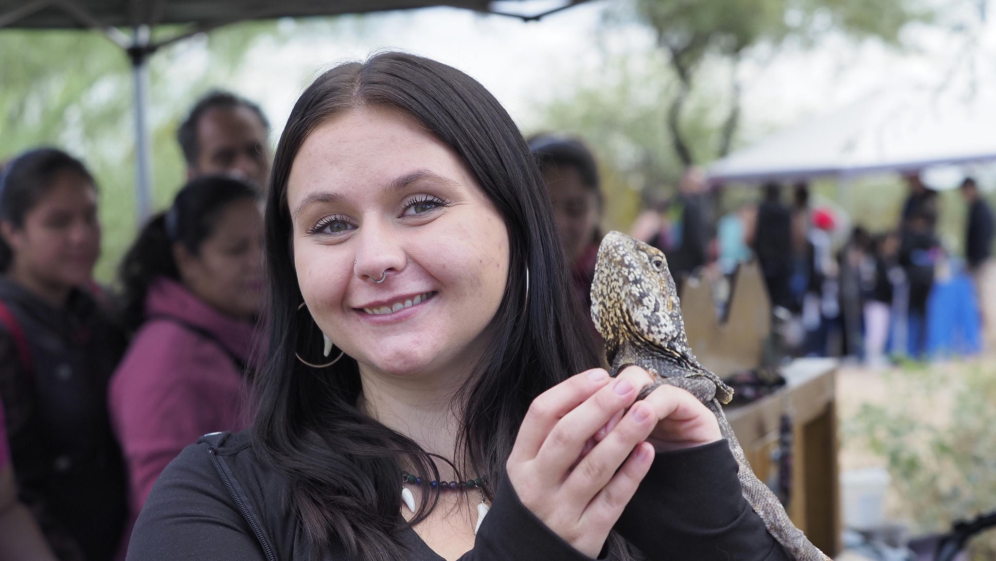 woman holding small bird