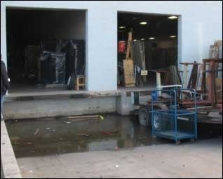 Flooded loading dock - example of bad storm water management