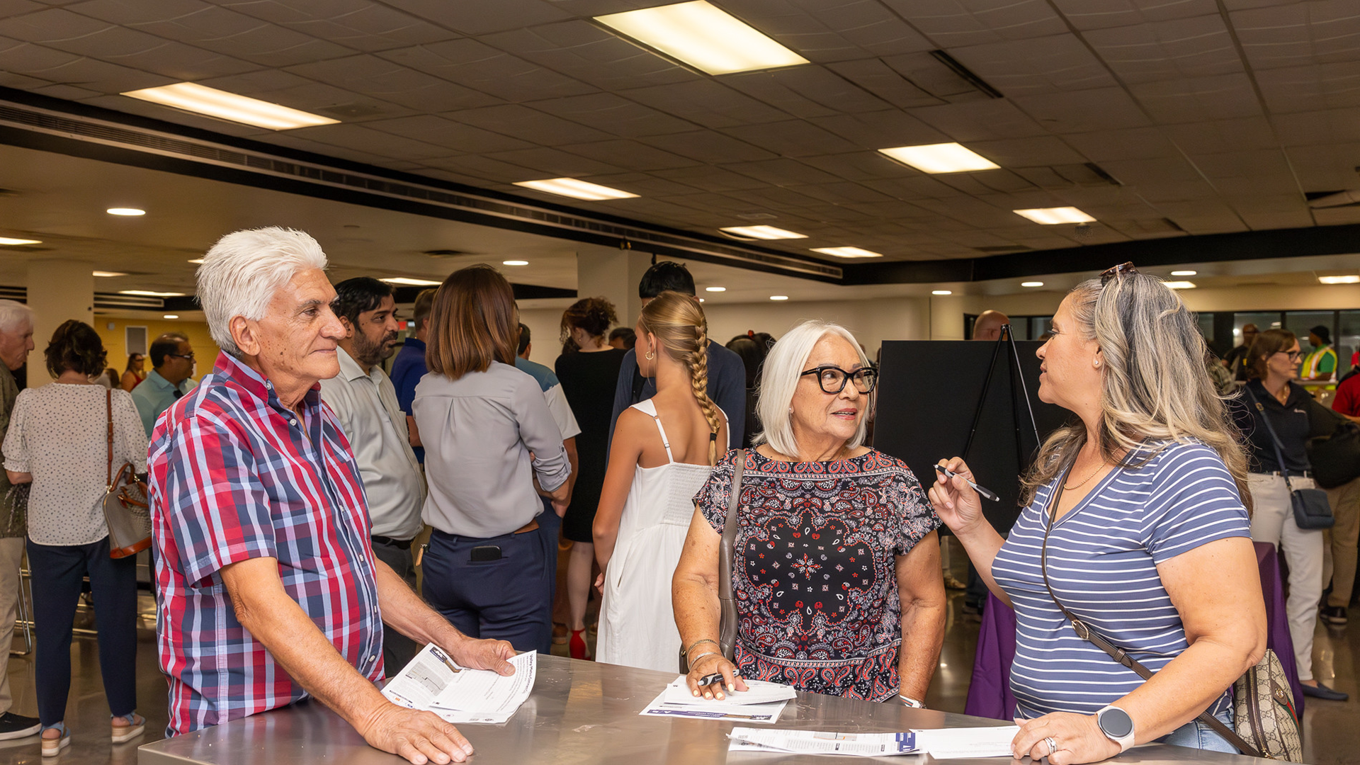 Community members speaking with Valley Metro and Phoenix staff about upcoming light rail projects. 