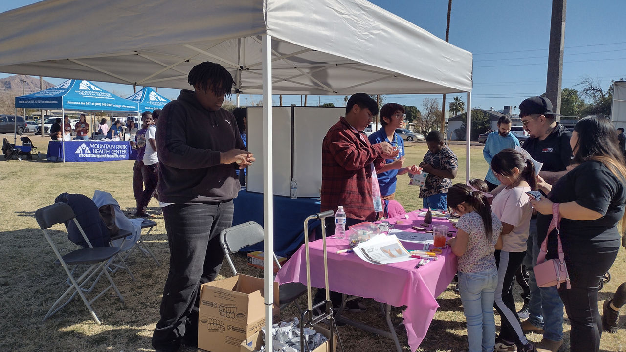SVM Teen Volunteers working in a Booth at an Outreach Event