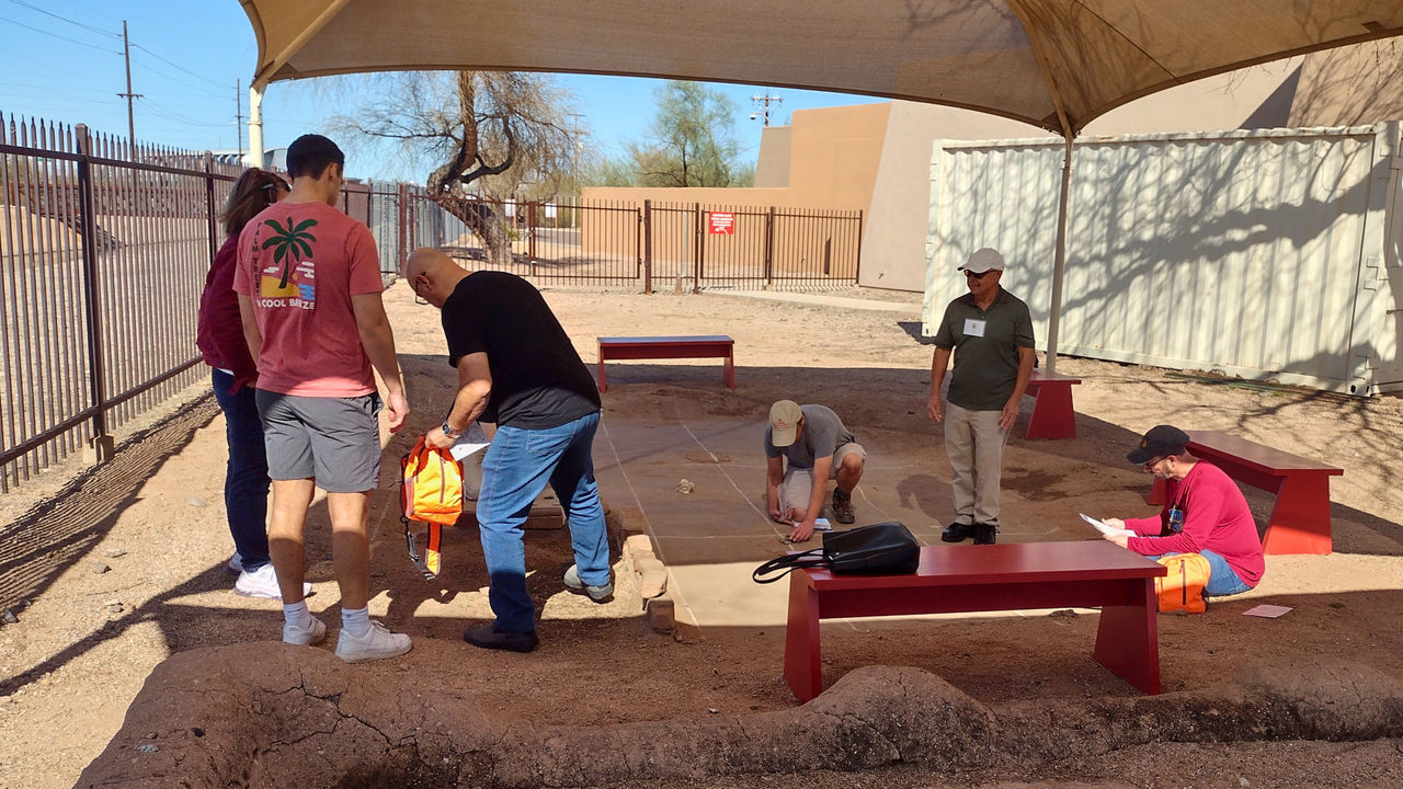 Group of museum visitors participating in Detective Archaeology activity